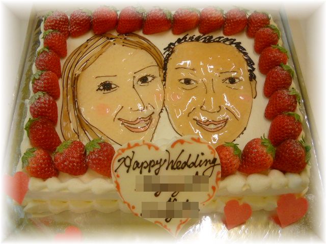 ２０１２年１月のご注文です。１８名様くらいのサイズのケーキに新郎新婦の似顔絵をかきました。苺もいっぱい飾りました。