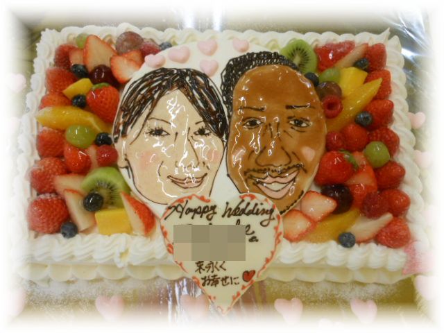２０１２年３月のご注文です。フルーツいっぱいのケーキに、お二人の似顔絵を描きました。