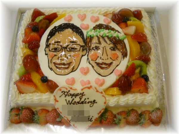 2010年12月のご注文です。20名様用のケーキに新郎新婦の似顔絵をかきました。