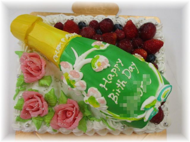 20名様用のケーキにベルエポックのボトルのイメージとバラのお花