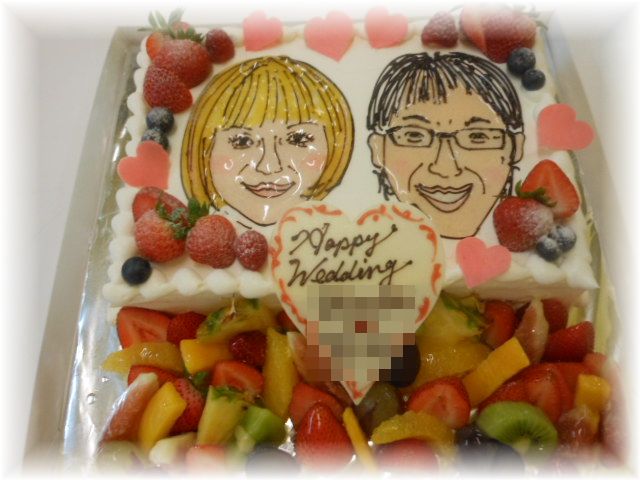 ２０１２年９月のご注文です。20名様用のケーキにお二人の似顔絵をお描きして、フルーツも飾りました。