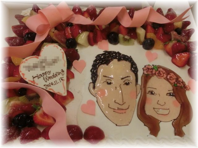 ２０１４ 年１１月のご注文です。フルーツいっぱいのケーキにリボンを飾って似顔絵を書きました。